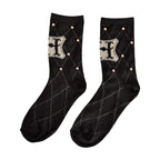 Produktbild Harry Potter - Hogwarts Logo Socken mit Nieten schwarz